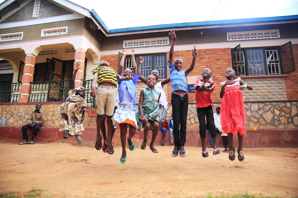 Children jumping at Kawempe Home Care