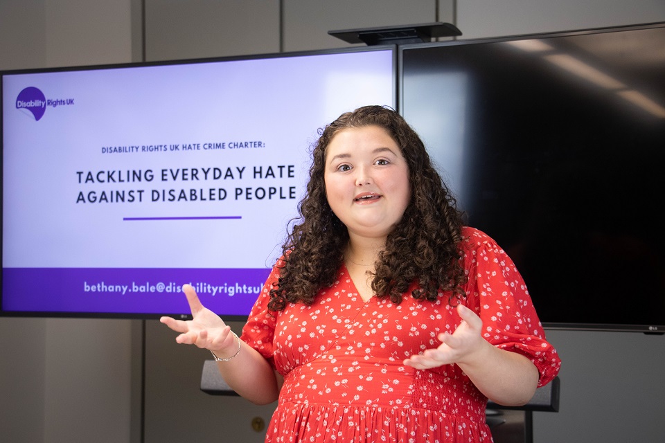 Person presenting the Disability Rights UK Hate Crime Charter